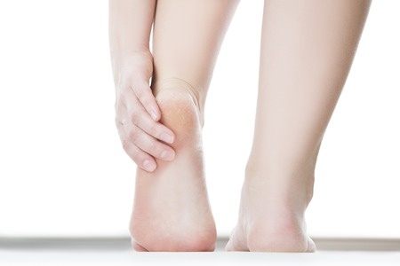 42300310 - massage of female feet. pedicures. isolated on white background.